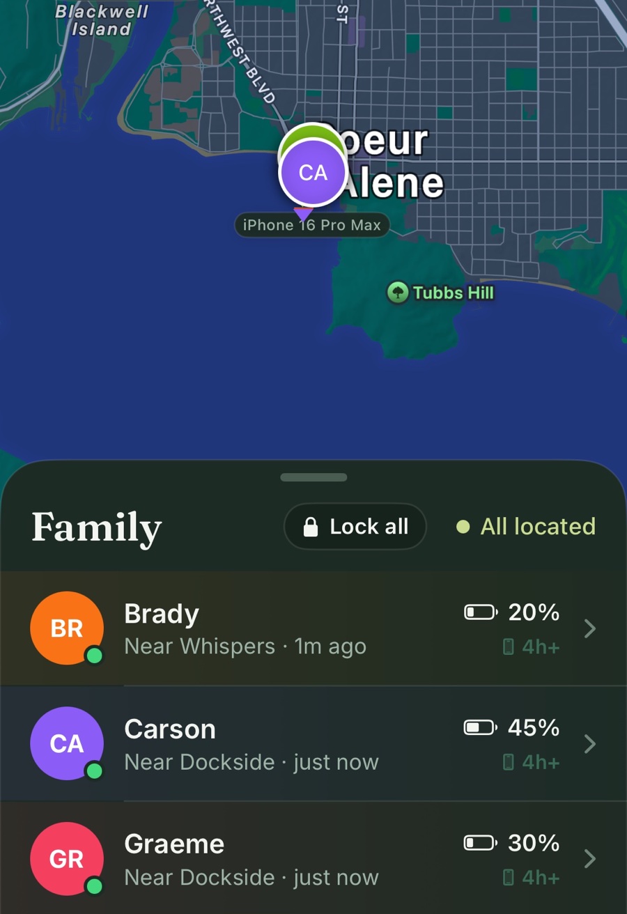 Clann's family map over Coeur d'Alene with Carson's pin, and the Family roster below it: Brady, Carson, and Graeme with their nearest place, last update, battery, and a Lock all button